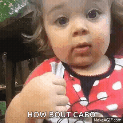 Baby Girl In Minnie Mouse Outfit Making Funny Face GIF