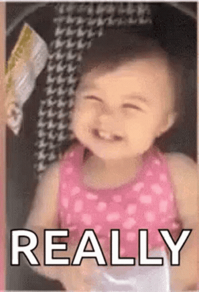 Baby Girl In Pink Dress Smiling In Stroller Saying Really GIF