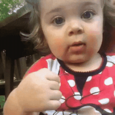 Baby Girl In Red And White Polka Dot Minnie Mouse Dress GIF