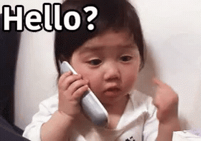 Baby Girl Talking On Cell Phone Making Funny Face GIF