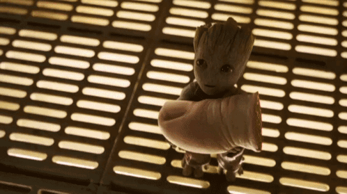 Baby Groot Held By Person's Arm GIF