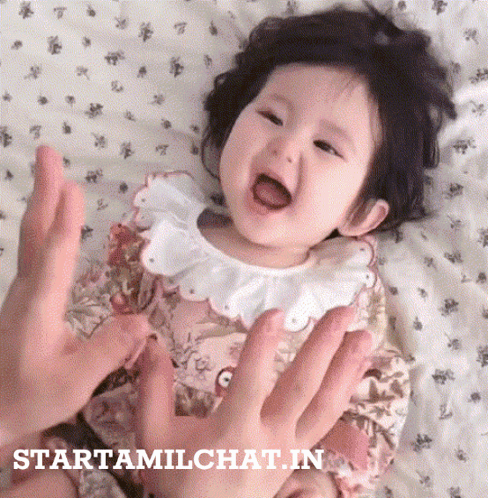 Baby Held By Person With Starttamilchat.in Visible GIF