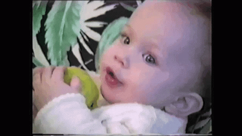 Baby Holding And Eating Green Apple GIF