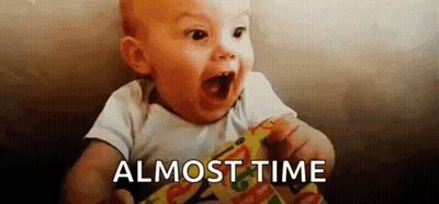 Baby Holding Candy Bar Saying Almost Time GIF