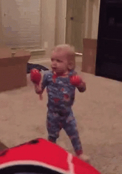 Baby Holding Maracas
