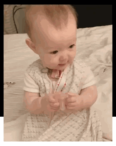 Baby Holding Pacifier In Blanket Sticker