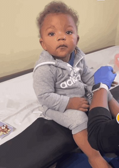 Baby In Adidas Jacket Sitting GIF