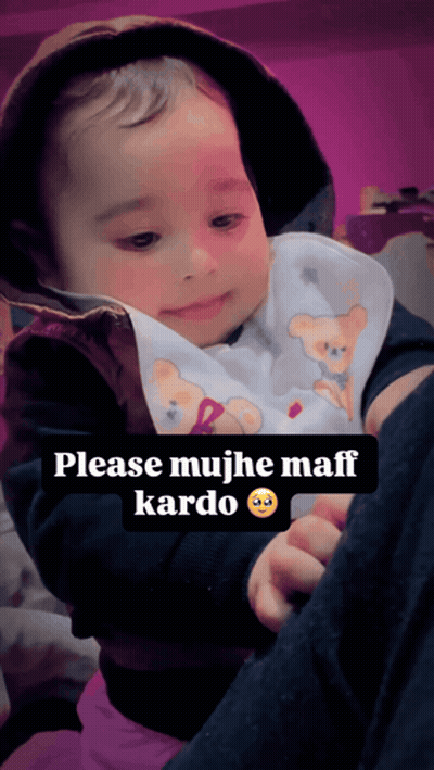 Baby In Bib With Teddy Bear Being Held GIF