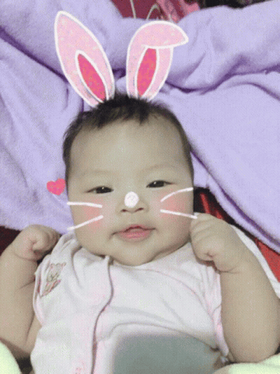 Baby In Bunny Ears And Cat Face Mask GIF