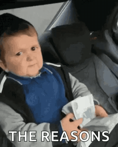 Baby In Car Seat Holding Paper Making Face GIF