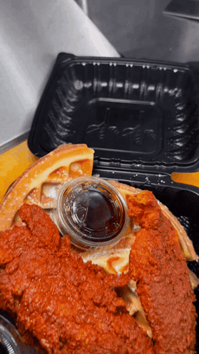 Baby In Cheetah Shirt Looking At Fried Chicken And Waffles GIF