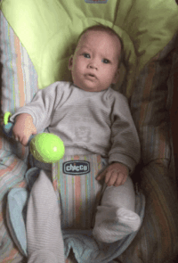 Baby In Chicco Bouncer Holding Toy GIF