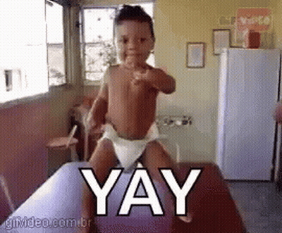 Baby In Diaper Pointing At Camera Saying Yay GIF