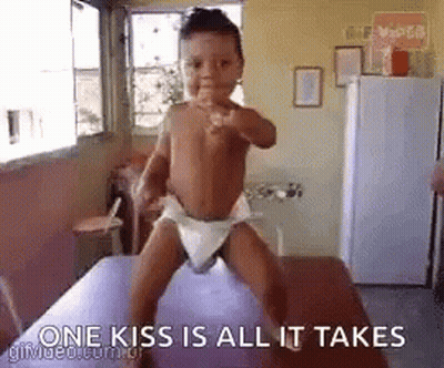 Baby In Diaper Standing On Table GIF