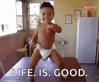 Baby In Diaper Standing On Table Saying Life Is Good GIF