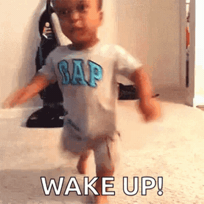 Baby in Gap Shirt Saying Wake Up