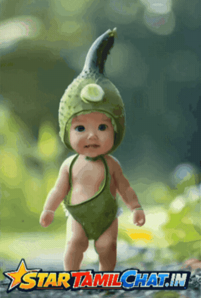 Baby In Green Costume With Cucumber Hat Saying Star Tamilchat.in GIF