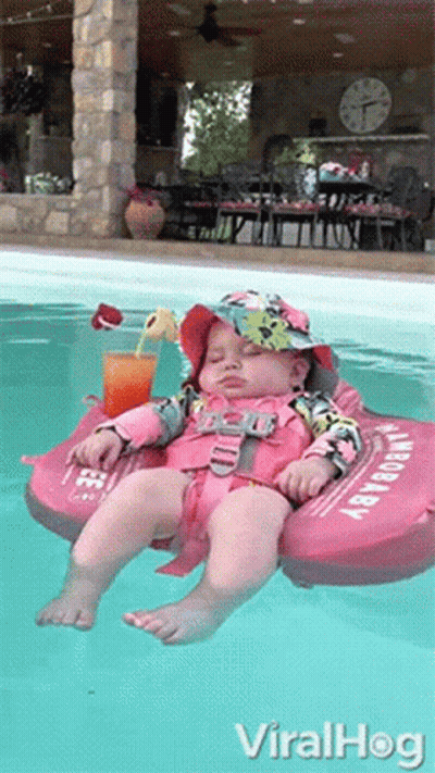 Baby In Life Preserver Floating GIF