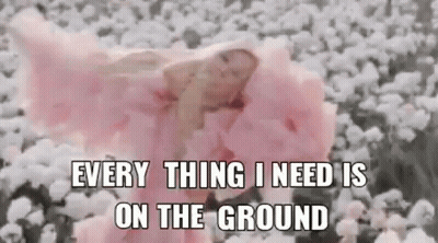 Baby In Pink Dress Lying In Cotton Field GIF