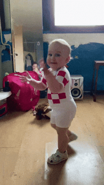 Baby In Red And White Checkered Outfit Dancing GIF