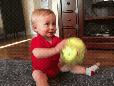 Baby In Red Shirt Playing With Ball GIF