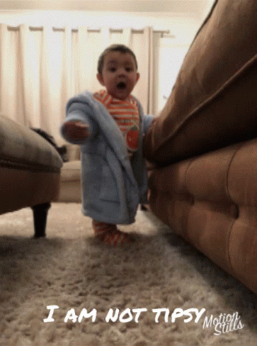 Baby In Robe Standing In Front Of Couch Saying I Am Not Tipsy GIF