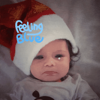 Baby In Santa Hat Saying Feeling Blue GIF