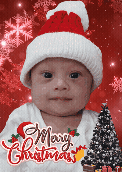Baby In Santa Hat Saying Merry Christmas GIF