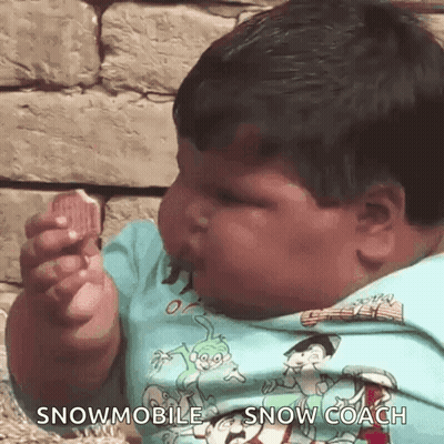 Baby In Snowmobile Shirt Eating GIF