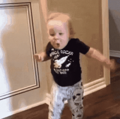 Baby In Space Racer Shirt Dancing In Hallway GIF