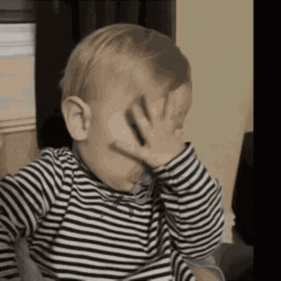 Baby In Striped Shirt Covering Face GIF