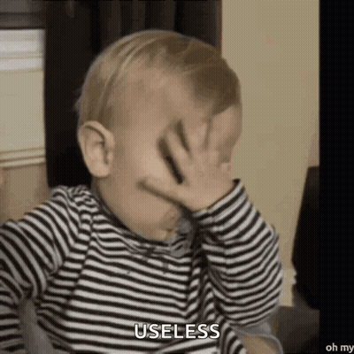 Baby In Striped Shirt Covering Face Saying Useless GIF
