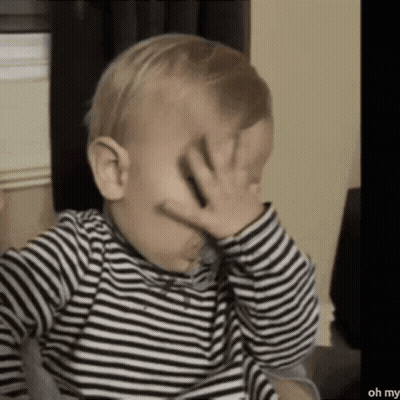 Baby In Striped Shirt Covering Face GIF