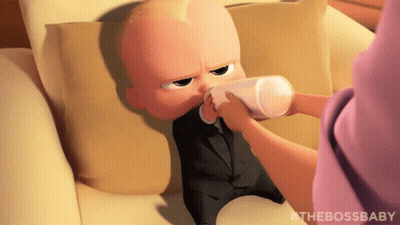 Baby In Suit Drinking Milk From Bottle GIF