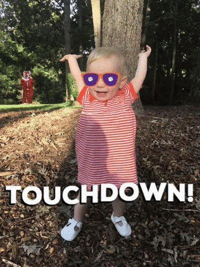 Baby In Sunglasses In Leaves Saying Touchdown GIF