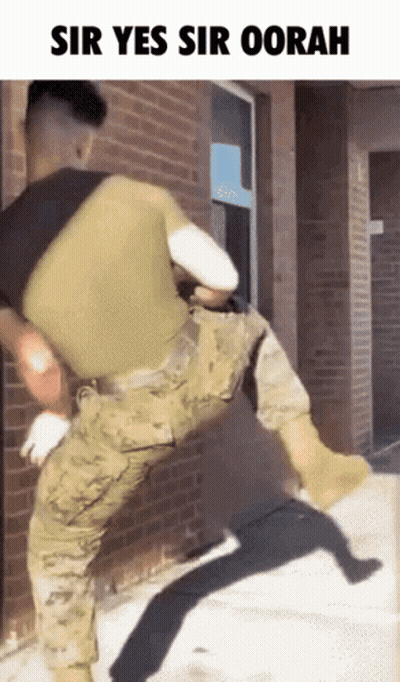 Baby In US Marines Uniform Chewing Crayons GIF