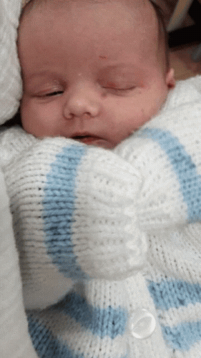 Baby In White And Blue Sweater GIF