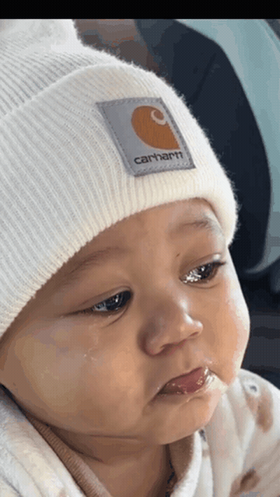 Baby In White Carhartt Beanie Looking At Camera GIF