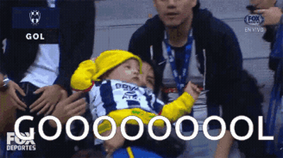 Baby In Yellow Hat Held By Man In Fox Sports Deportes Ad GIF