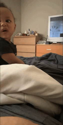 Baby Lying On Bed GIF