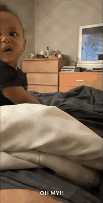 Baby Lying On Bed Saying Oh My GIF