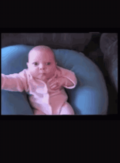 Baby Lying On Blue Pillow GIF