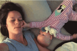 Baby Lying With Mom GIF