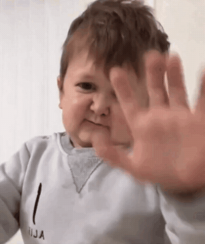 Baby Making Funny Face Covering Ears GIF