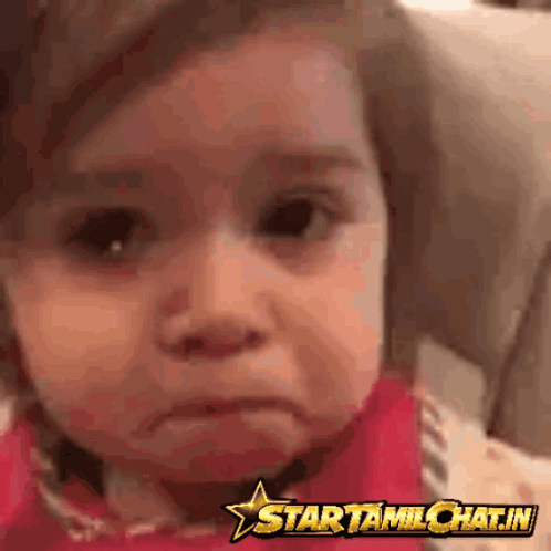 Baby Making Funny Face In Front Of Star Sign GIF