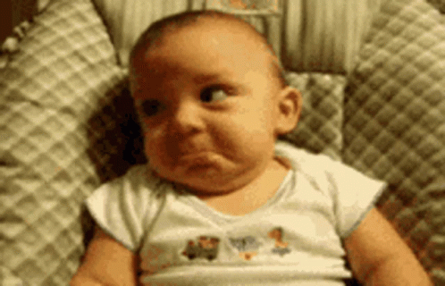 Baby Making Funny Face In High Chair GIF
