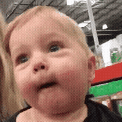 Baby Making Funny Face in Store