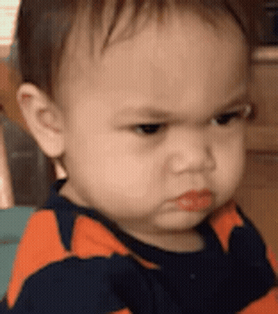 Baby Making Funny Face GIF