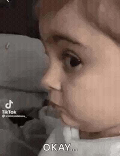 Baby Making Funny Face Saying Okay GIF