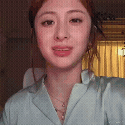 Baby Making Funny Face Sitting In Front Of Wall GIF
